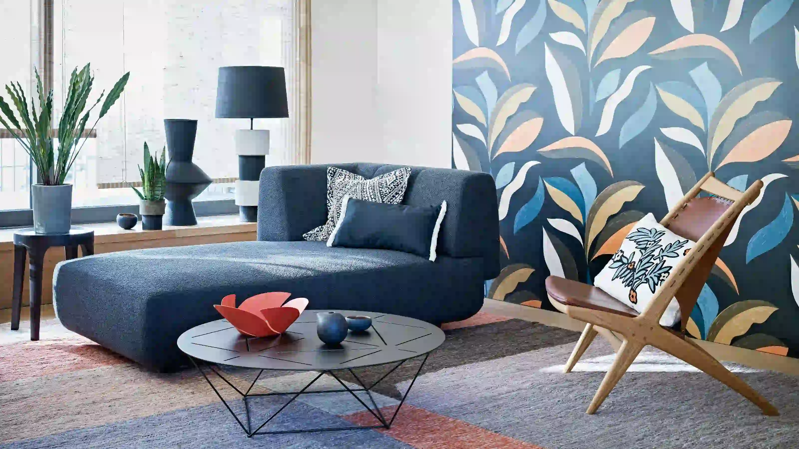 Colorful botanical wallpaper creating an accent wall in a living room